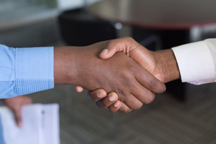 A handshake after acquiring a new customer.