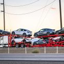 cars being shipped on a truck